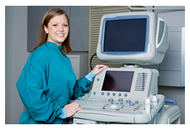 Medical professional standing proudly with new ultrasound system