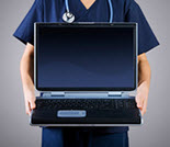 Medical staffer holding laptop Medical staffer holding laptop