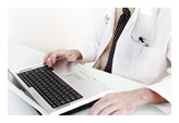 Doctor at laptop Doctor at laptop
