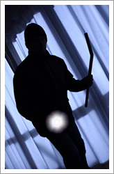 Shadowy prowler with flashlight Shadowy prowler with flashlight