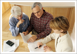 Home alarm company rep and customers reviewing paperwork Home alarm company rep and customers reviewing paperwork